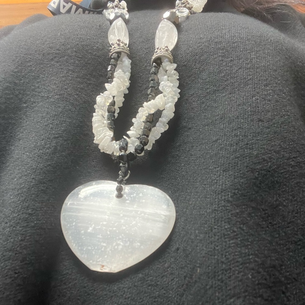 Gorgeous black and white long necklace with white heart.